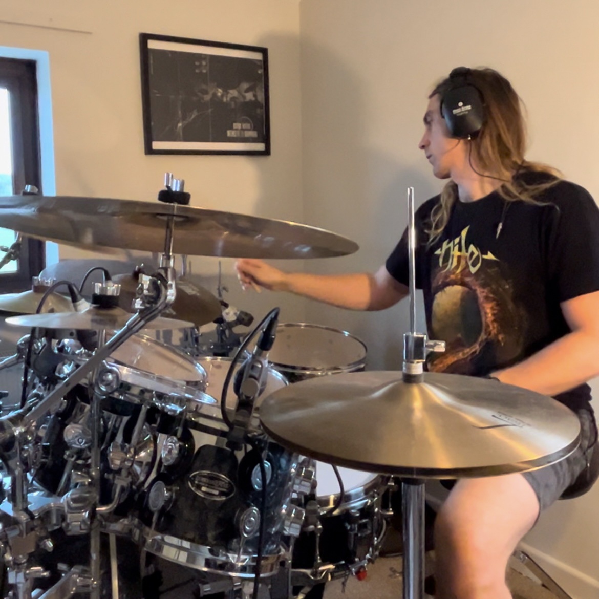 Photo of Jacob Fenton, drummer and drum teacher, playing drums